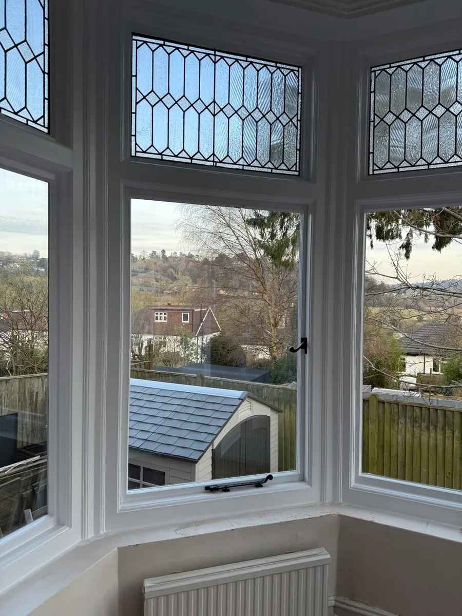 Restored timber sash window on a period brick house
