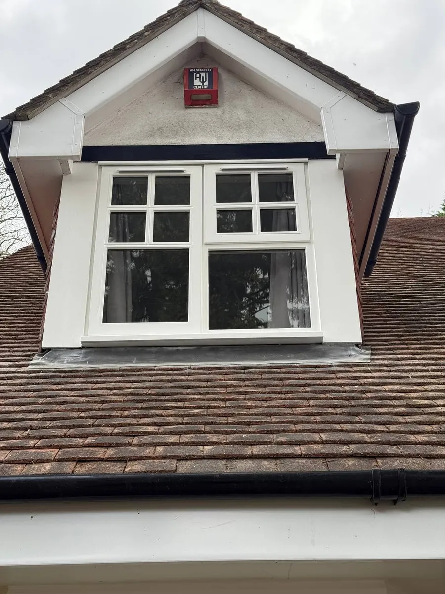 Restored timber sash window on a period brick house