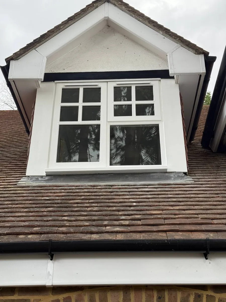 Restored timber sash window on a period brick house