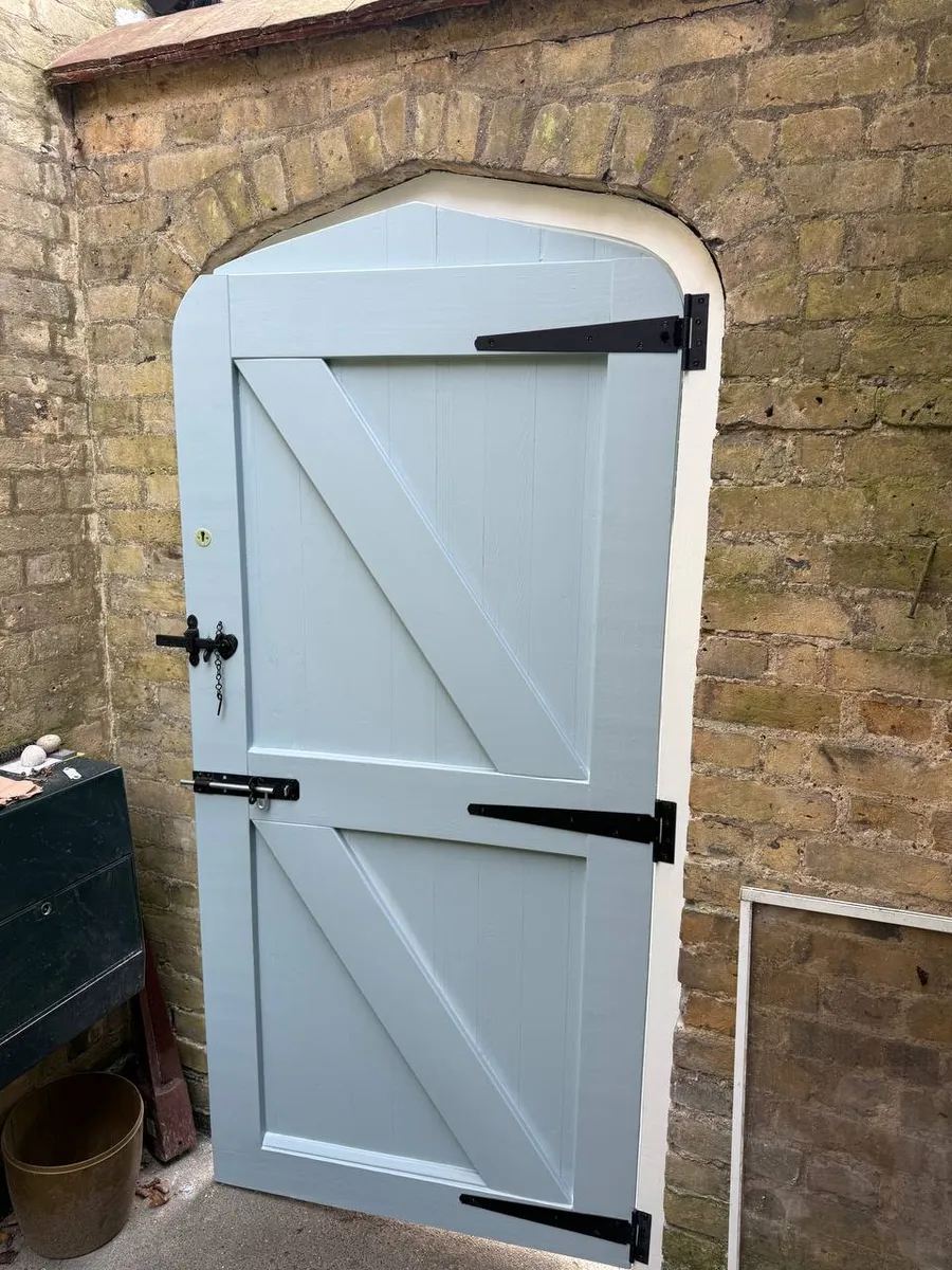 Restored timber sash window on a period brick house