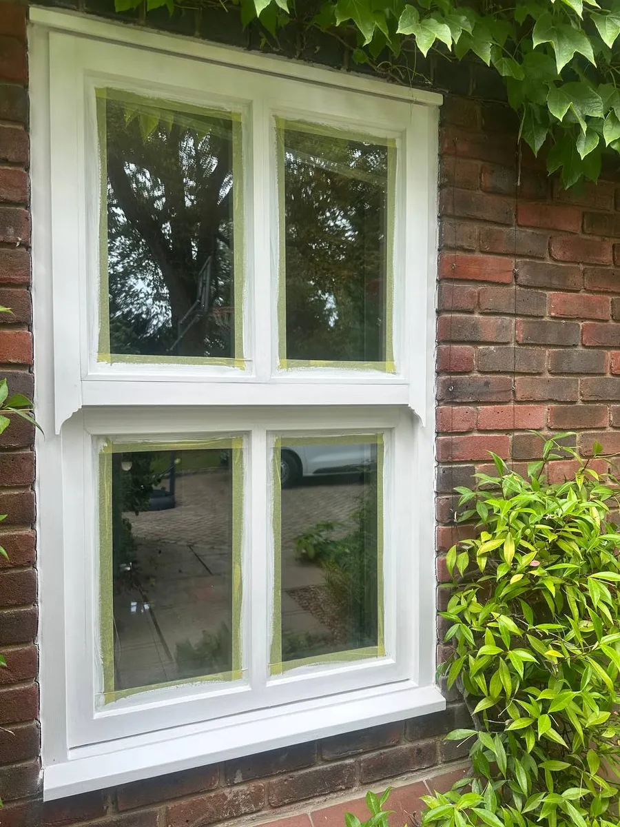 Freshly painted timber sash window during restoration